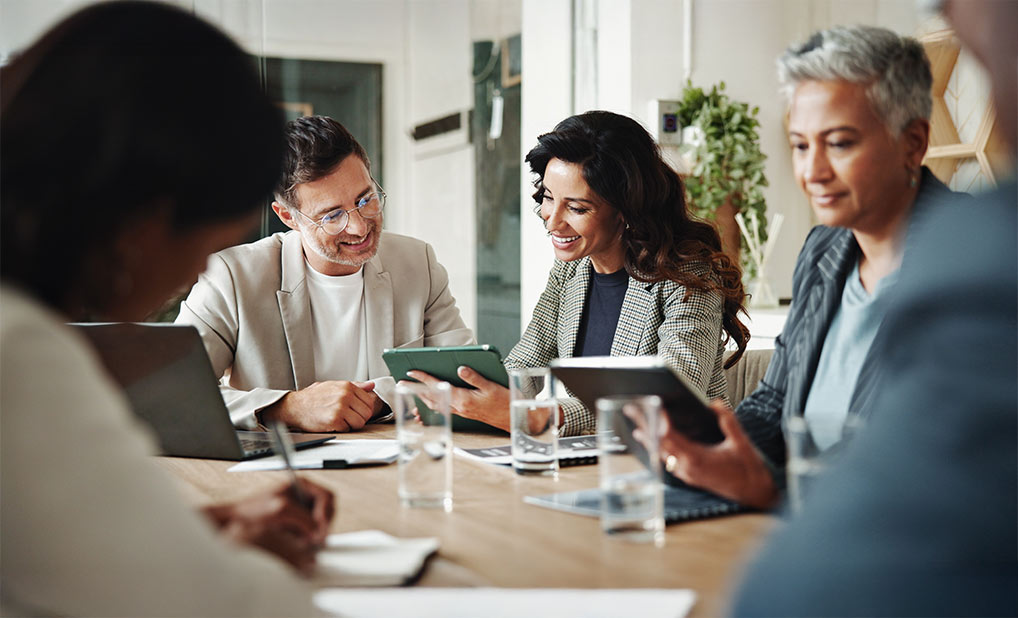 Group of business people talking at table