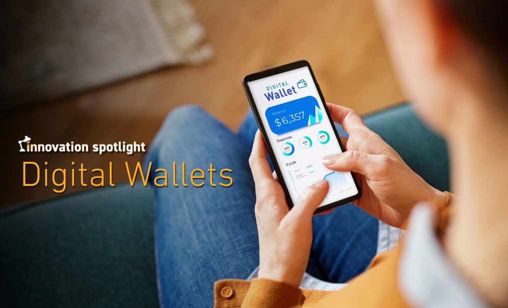 Close up of person using phone with text overlay that reads Innovation spotlight: digital wallets