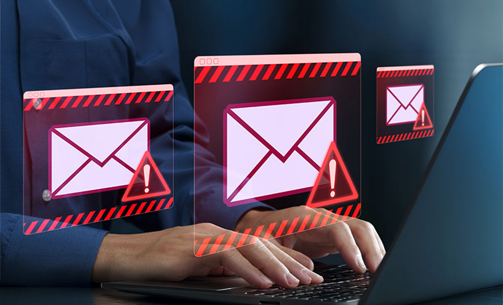 Close up of person using computer with graphic overlay of email alerts