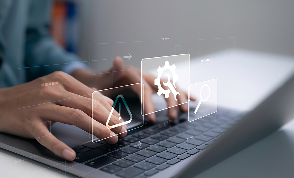 Close up person typing on laptop keyboard