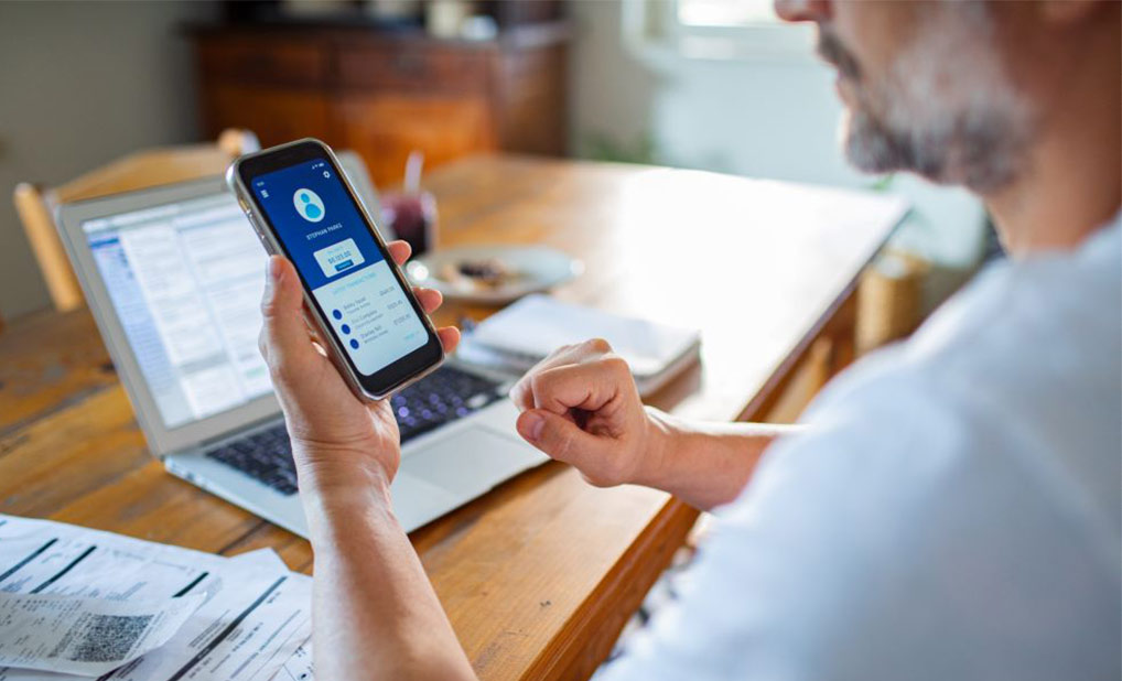 Close up of person looking at account information on phone