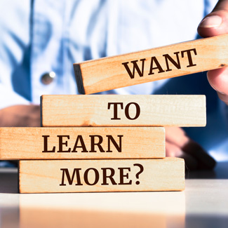 stacked blocks that say 'want to learn more?'