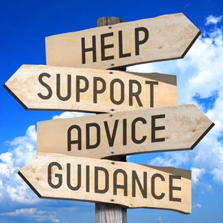 a pile of multicolored papers with question marks on them