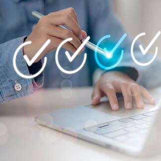 Hands drawing a checkmark