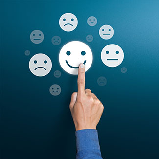 A finger taps on the smiley icon